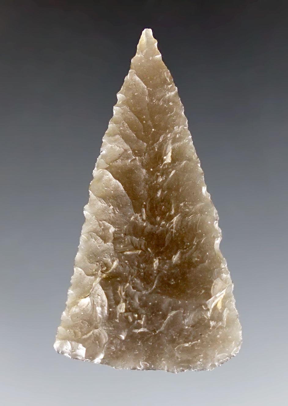 Excellent flaking on this 1 9/16" Triangular point found in Modoc Co., California. Obsidian.