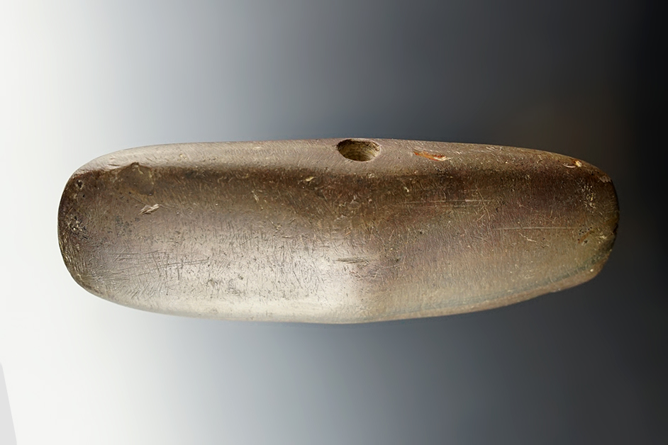 Deeply patinated 5 1/8" Bannerstone - Huron Co., Ohio. Drilling started but not completed.