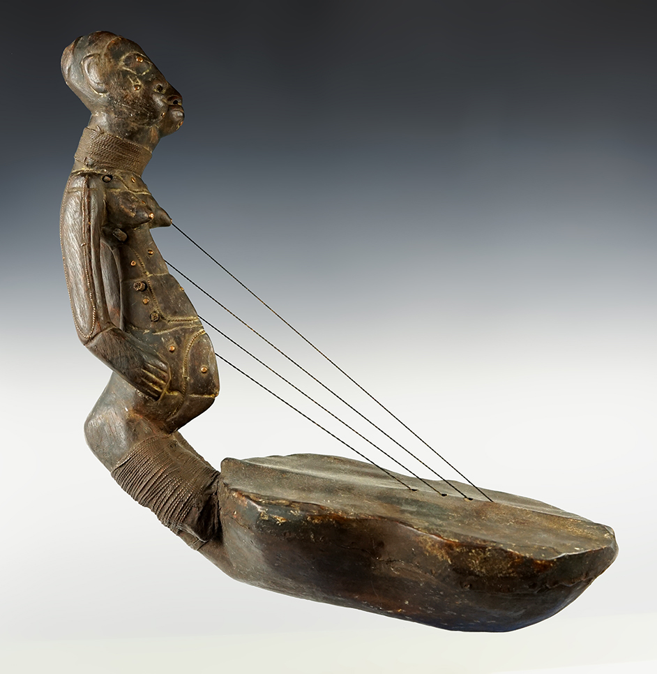 18" x 18" Punu style Harp that is made from Leather and Wood. Recovered in Gabon, Africa.