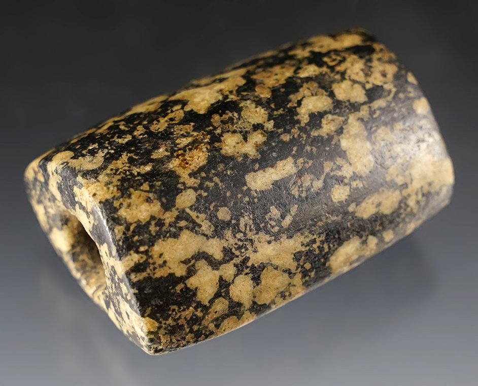 1 15/16" x 1 3/8" "D" Bannerstone found in Seneca Co., Ohio. From black and white Hardstone.