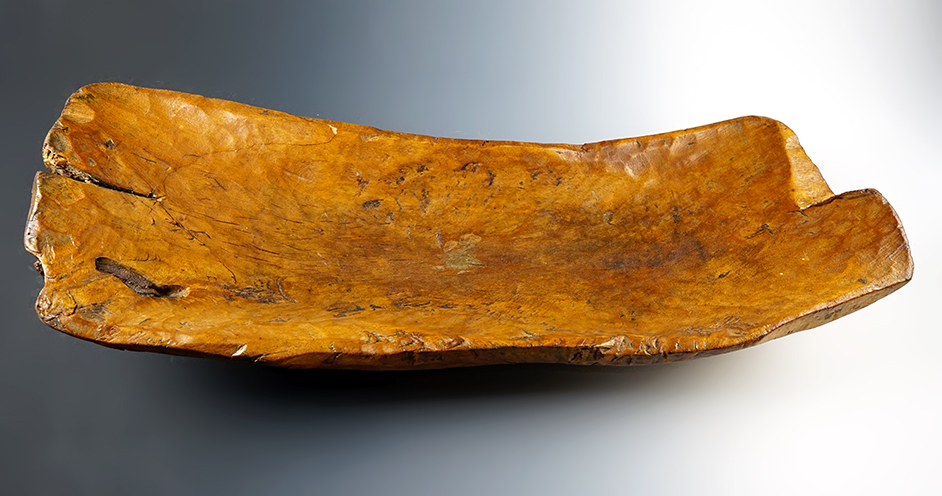 26 1/2" long by 9" wide vintage hand carved Wooden Bowl. Recovered in the New York area.