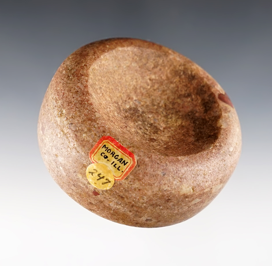 2 3/4" Double Cupped Discoidal made from pink Hardstone. Found in Morgan Co., Illinois.