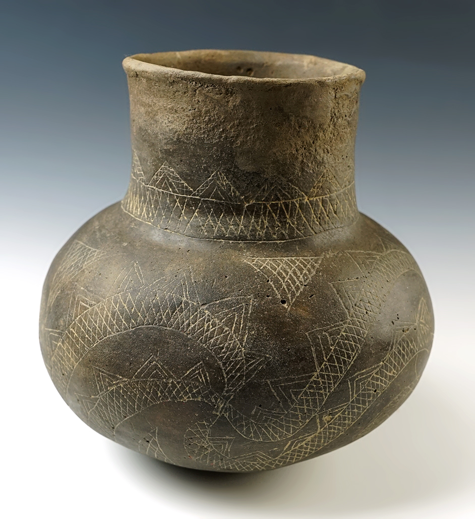 7 1/2" tall x 7 5/8" wide Mississippian Walls engraved Bottle. Restoration to half of the rim.