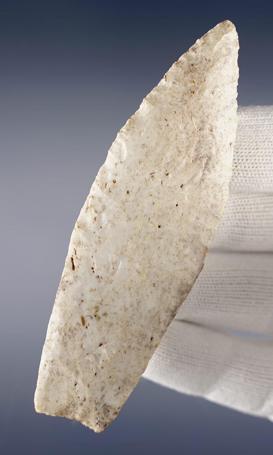 Fine 3 15/16" Agate Basin found in Saline Co., Missouri with grinding to the blade edges.COA.
