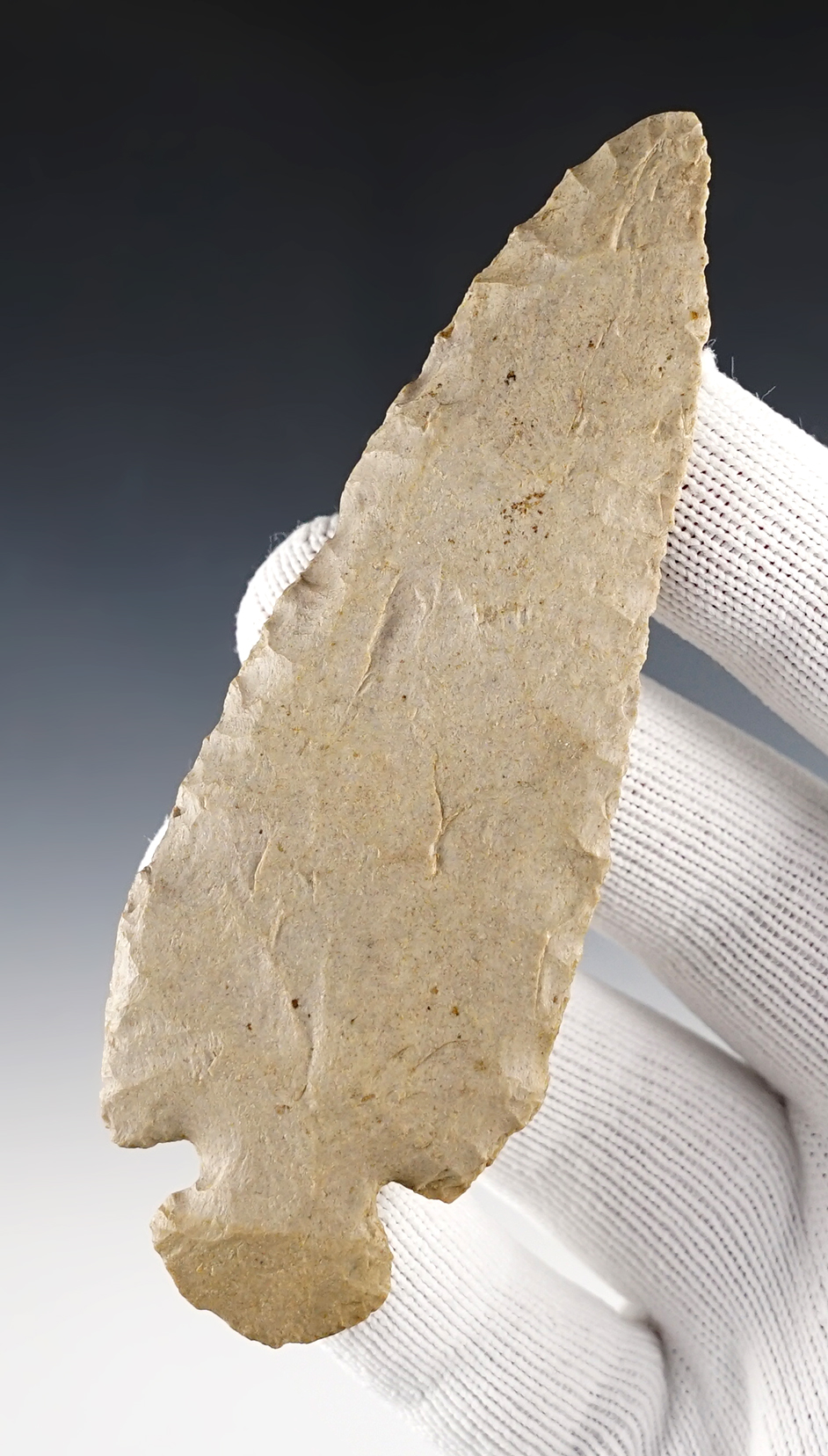 4 3/8" beveled Knife that is nicely styled. Small flat spot on one side of the tip. Found in Kansas.