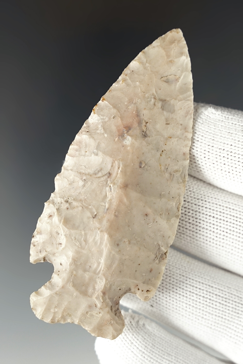 3 1/8" Cornernotched point that shows excellent age on the surface. Base is not ground.  Ohio.