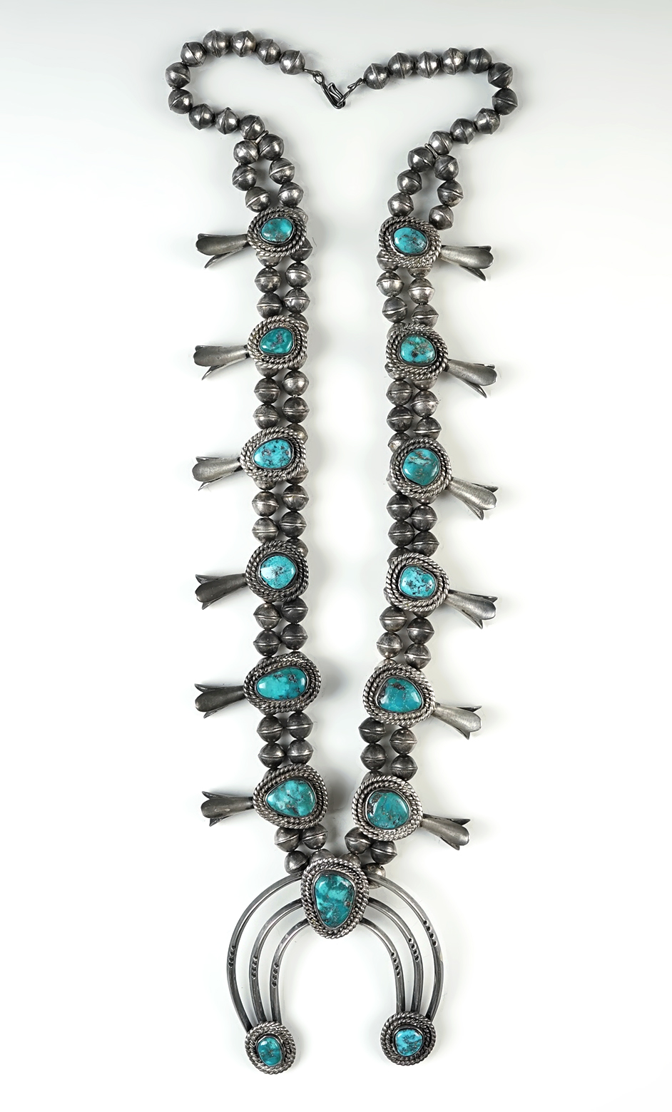 Vintage Southwestern Squash Blossom Necklace with Turquoise insets.